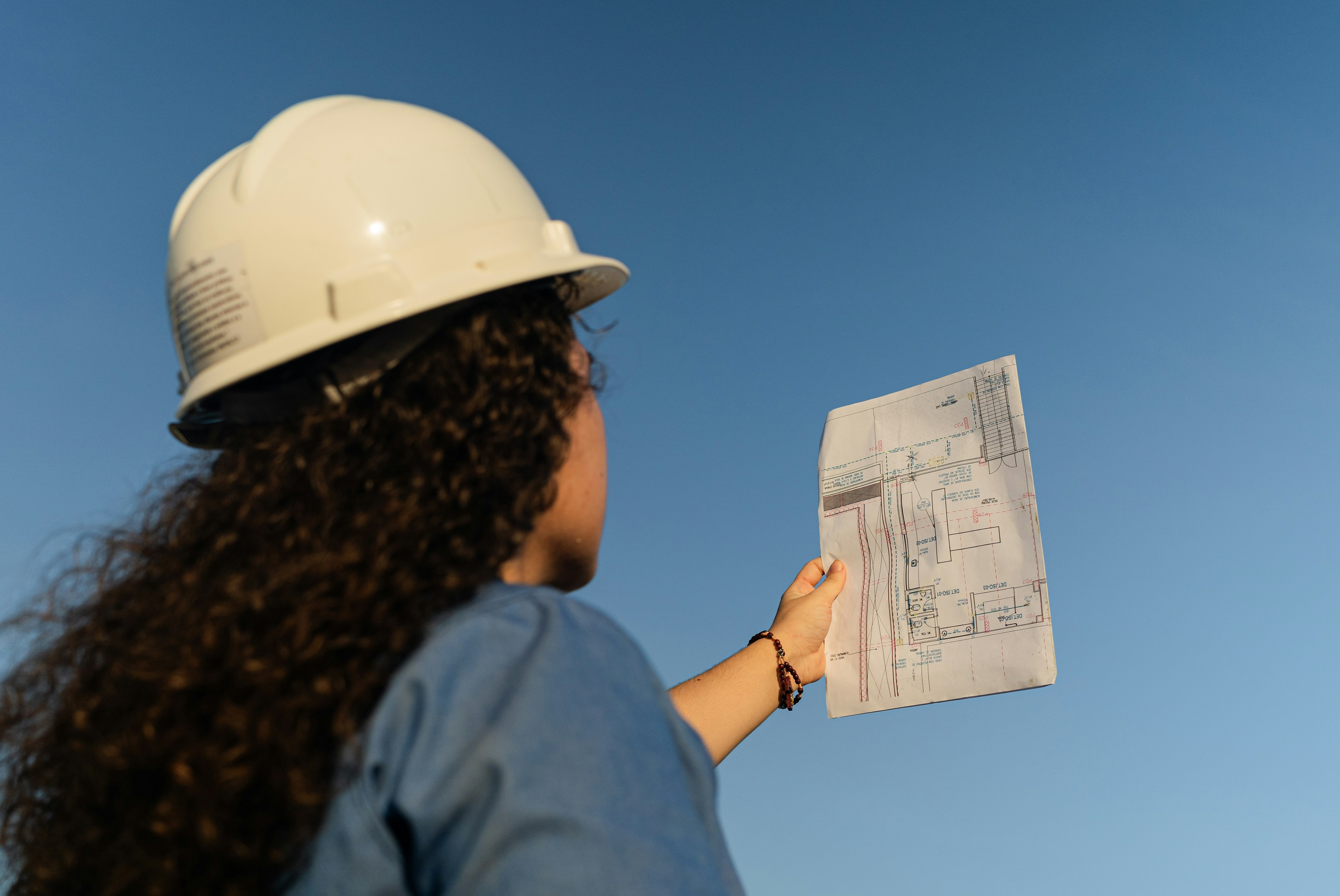 engineer reviewing project drawings on an infrastructure site