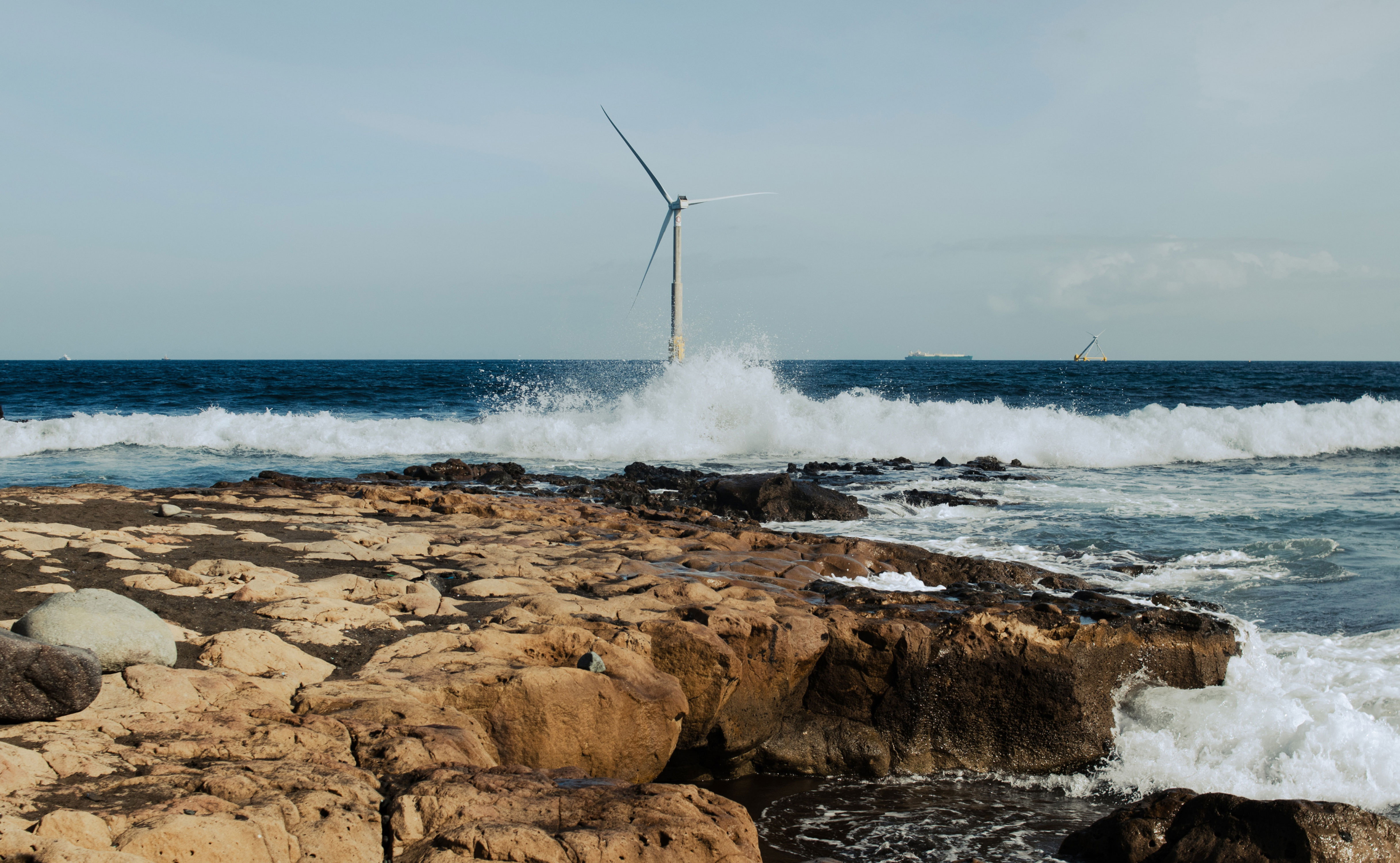 reflow windmill on sea image