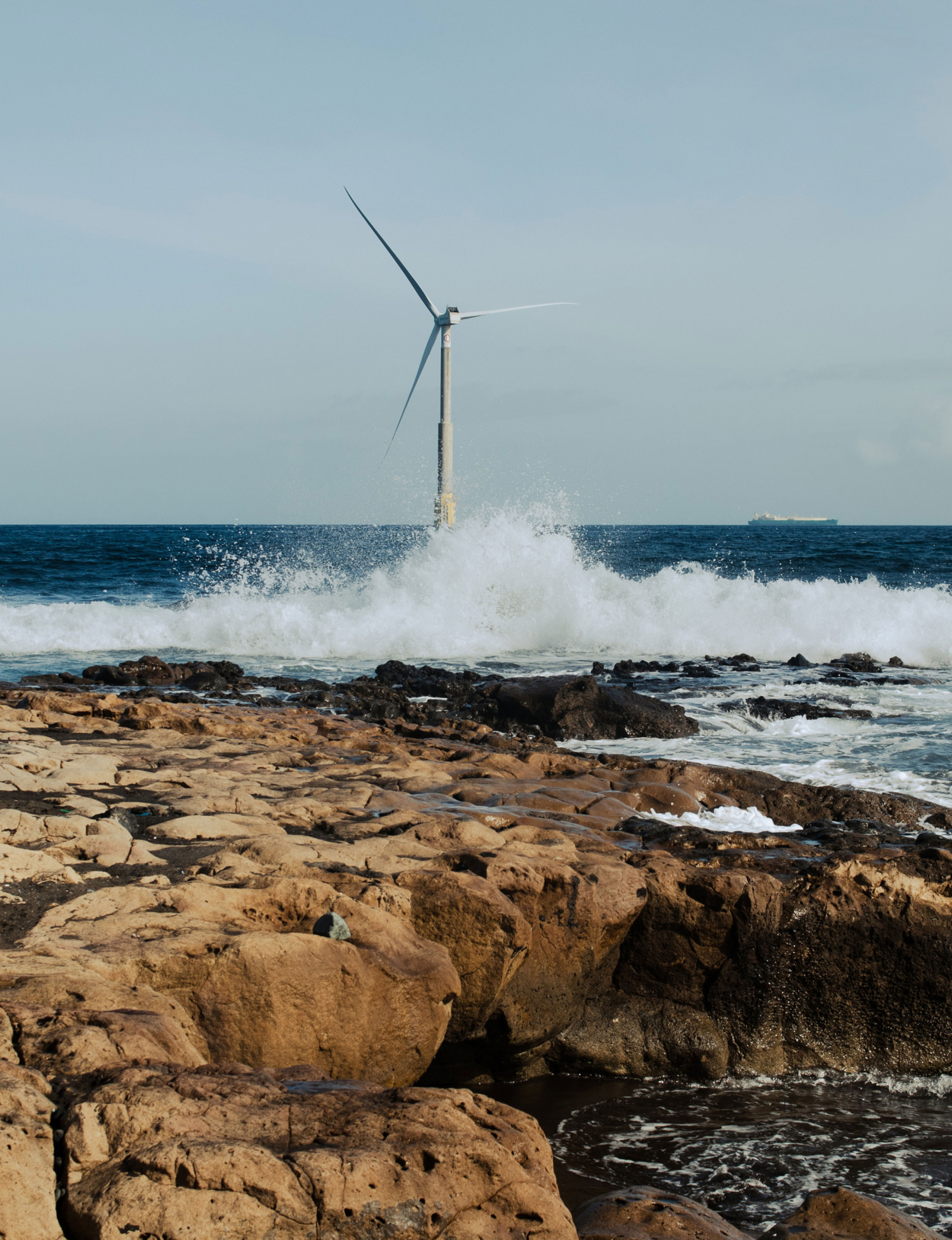 reflow windmill on sea image